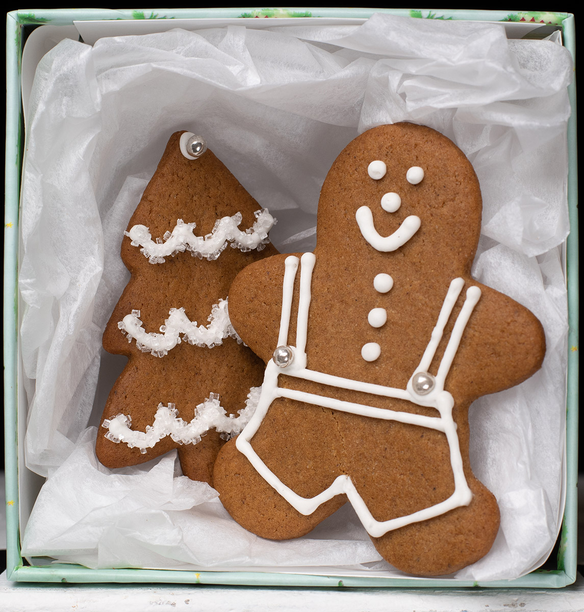 Gingerbread cookies in a box with white tissue paper
